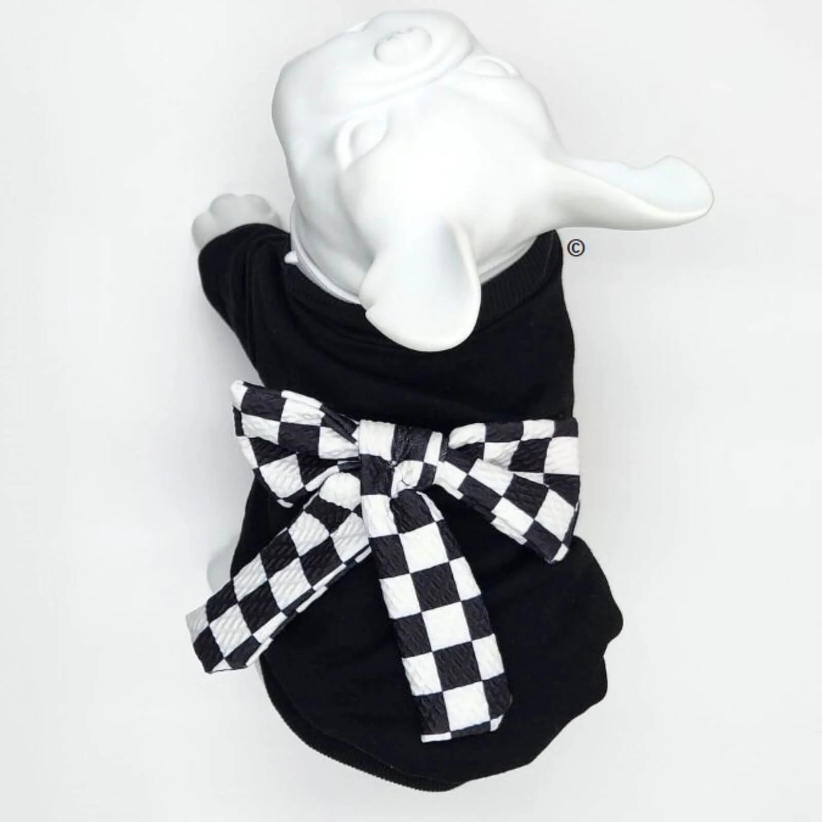 Black Sweatshirt with Checkered Bow on Back for Dogs Make a bold statement with our Designer Black Sweatshirt adorned with a charming checkered bow on the back. This fashion-forward piece effortlessly combines style and warmth, keeping your canine companion snug during chilly days. Let them strut their stuff with confidence while showcasing a dash of elegance that's sure to turn heads. Crafted for comfort and tailored for trendsetting pups, this sweatshirt is a must-have addition to your pup's wardrobe.1