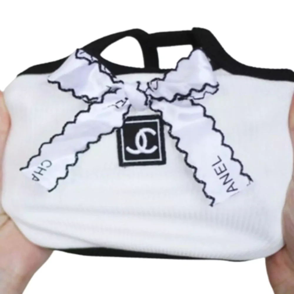 "Chanel Ripped Sleeveless Tee: Playful Elegance for Your Pup | Shop Now and Wag in Style!"